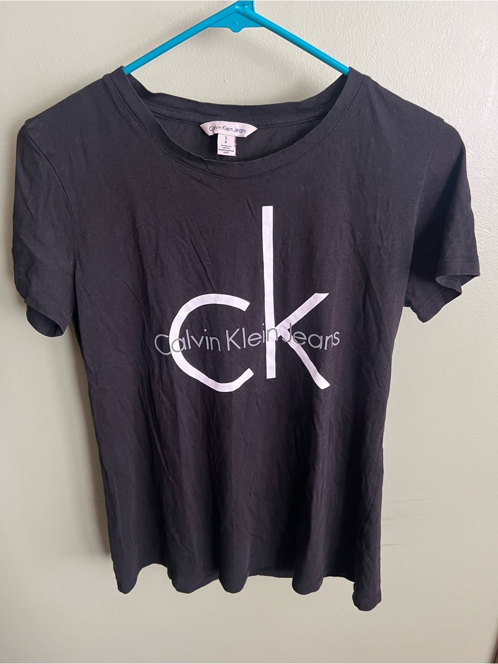 Calvin Klein Jeans Black Tee with White Label and Blue Logo Stitching